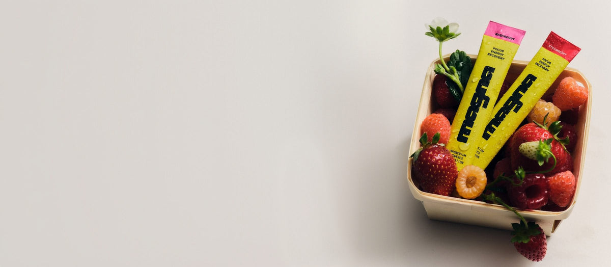 Berry basket of strawberries and raspberries with two Magna stick packs